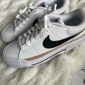 Nike Womens White Sneakers with Black Swoosh and Tan Accent